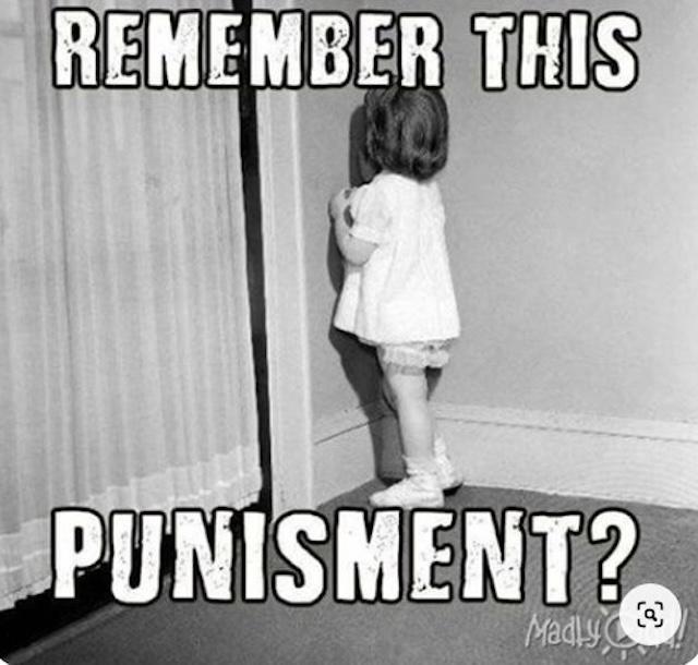 A classic time-out punishment, where a child is sent to stand in the corner to reflect on their actions—a common practice in many households years ago